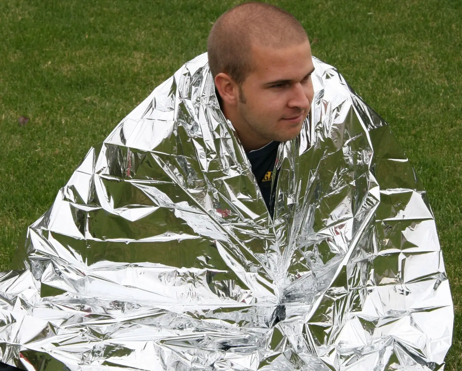 man covered in space blanket